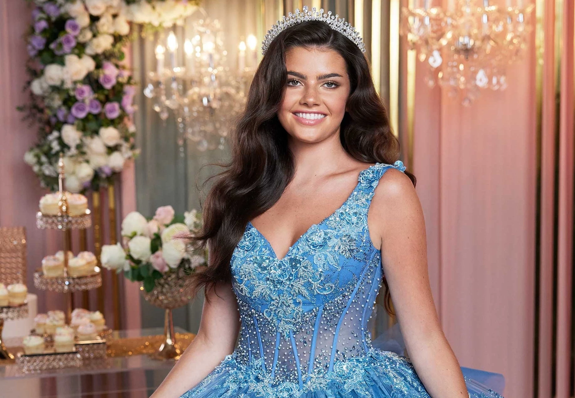 model wearing a pink quinceanera dress