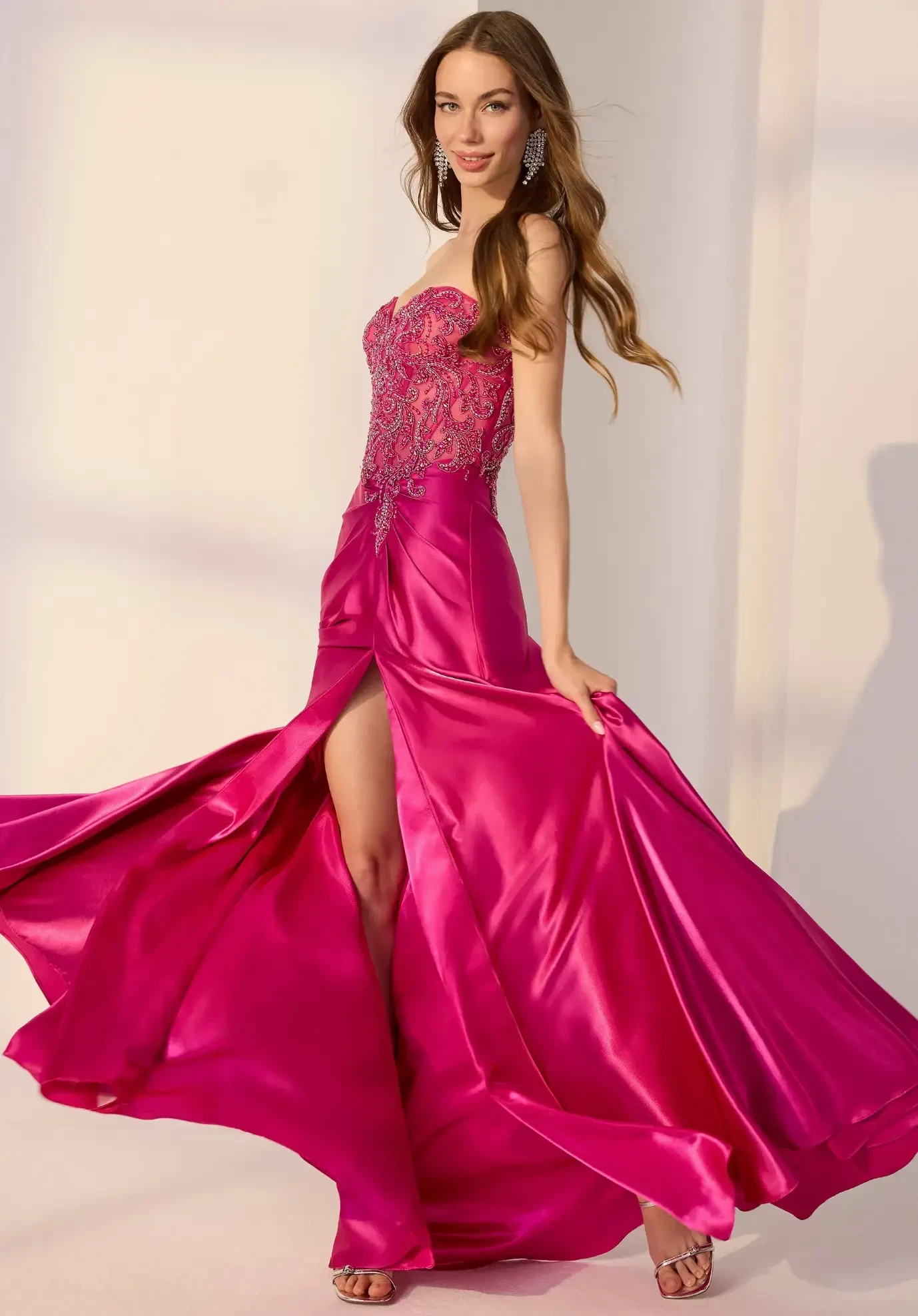 model wearing a magenta prom gown