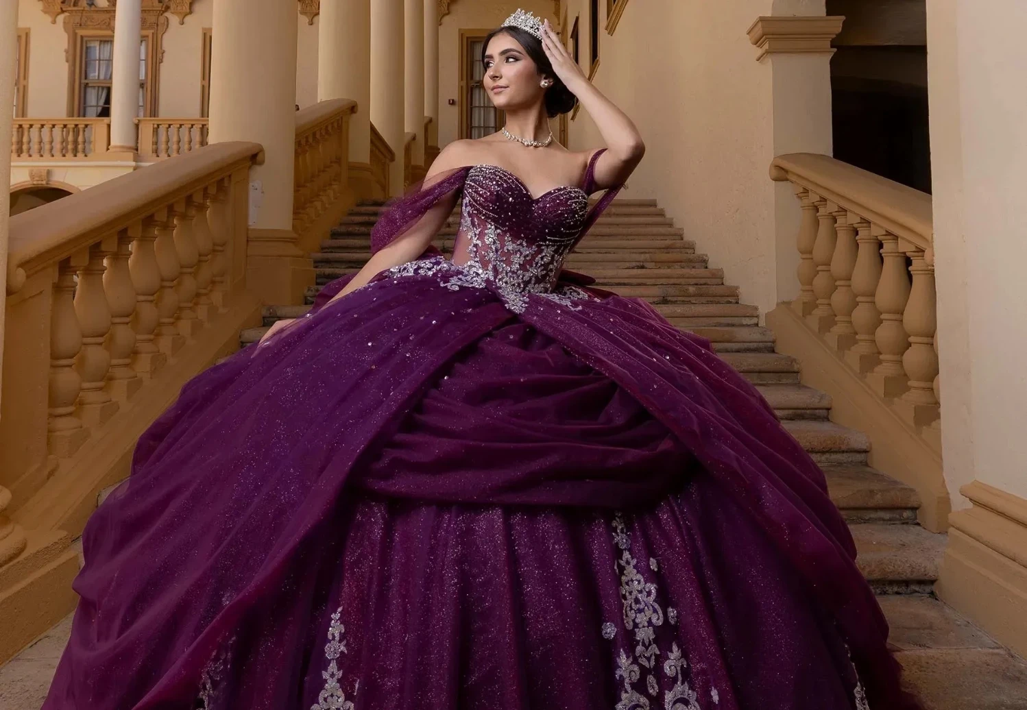 model wearing a pink quinceanera dress